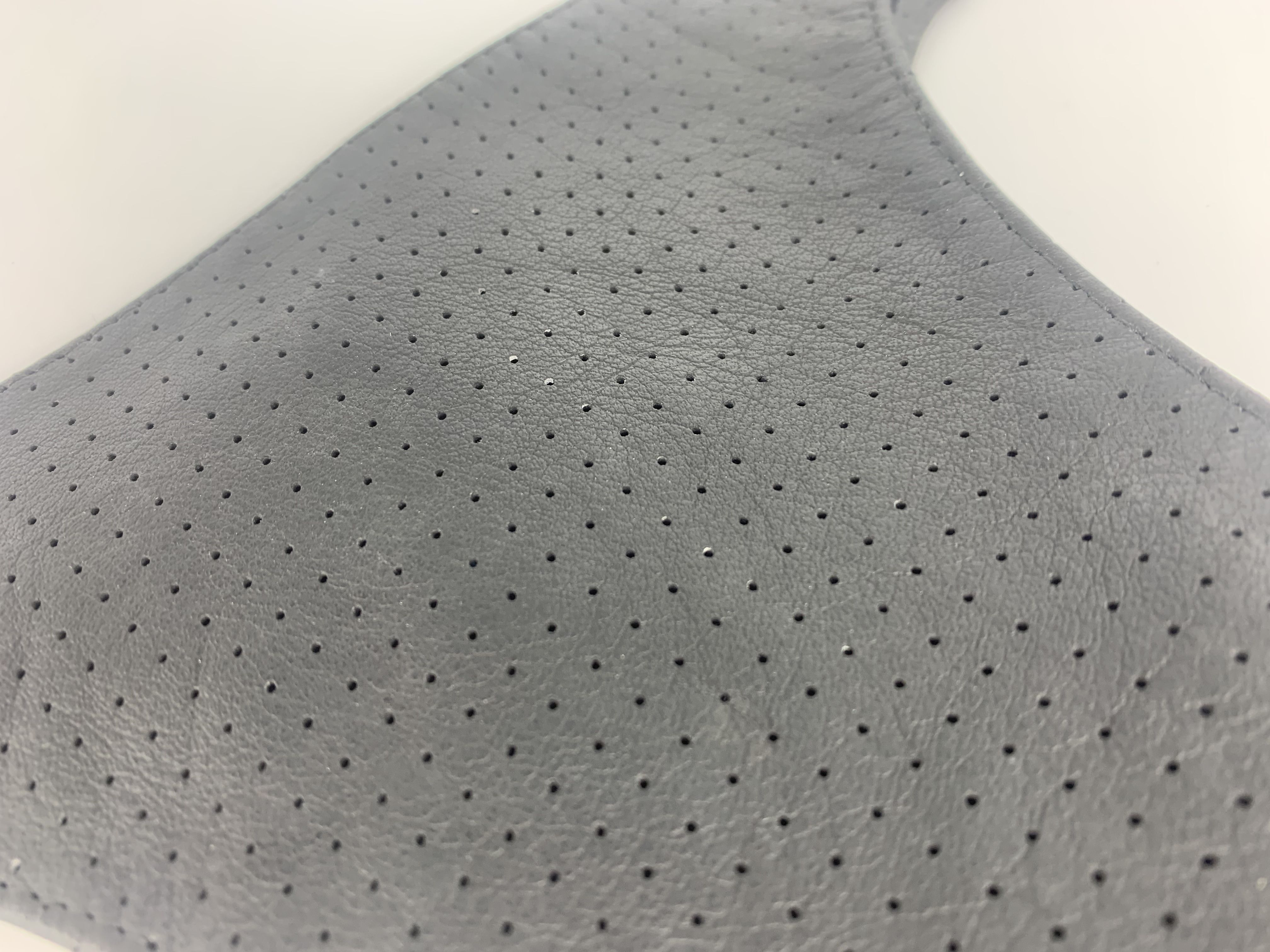 Women's thong made of perforated leather