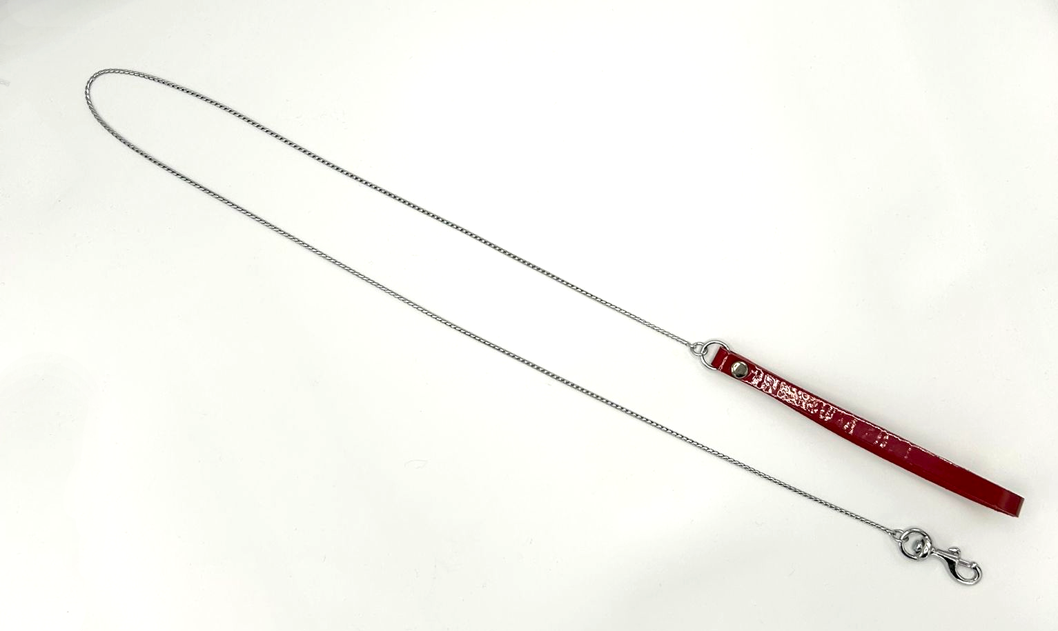delicate lead line with red patent leather loop