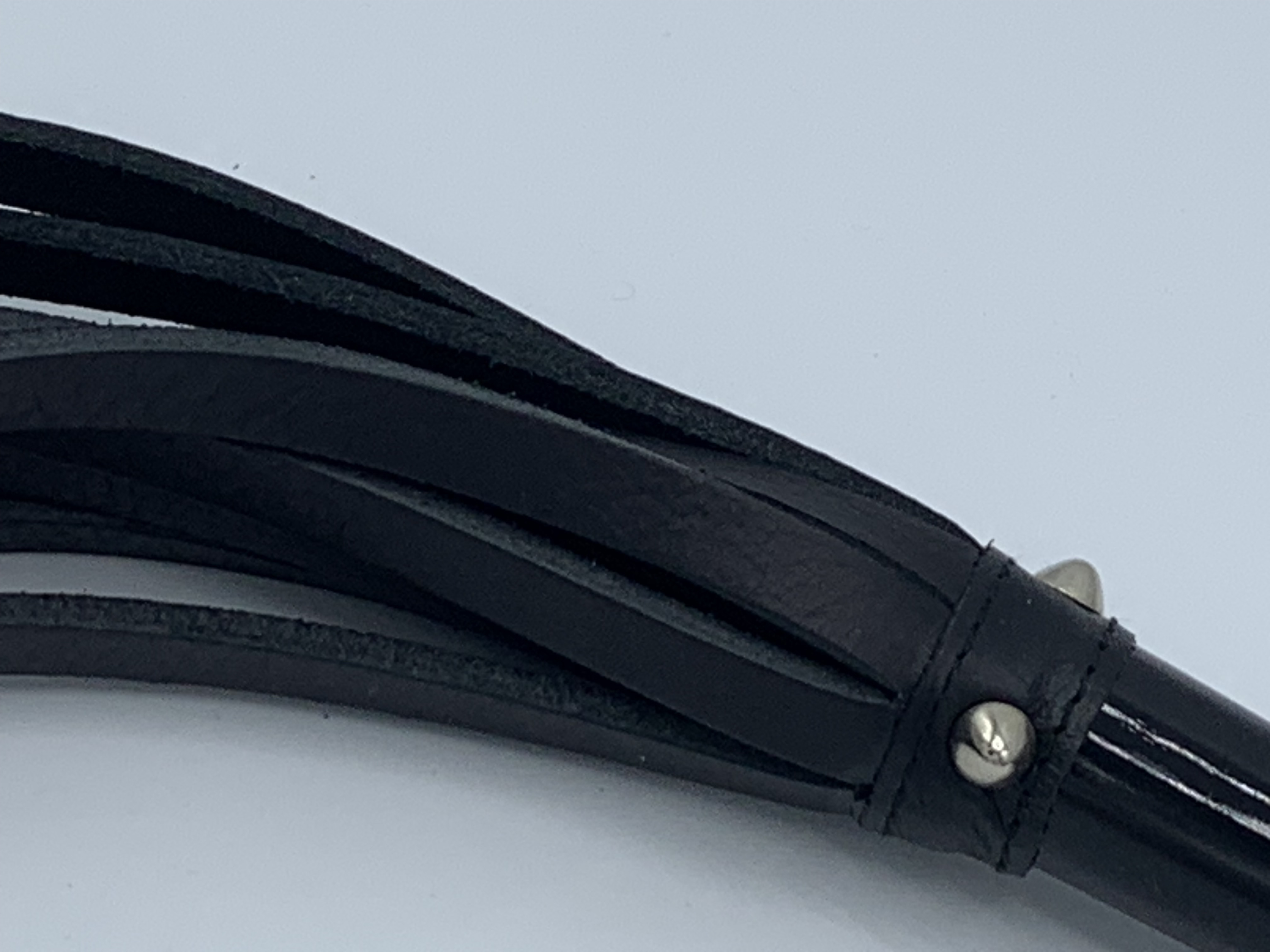 Whip with heavy hard straps