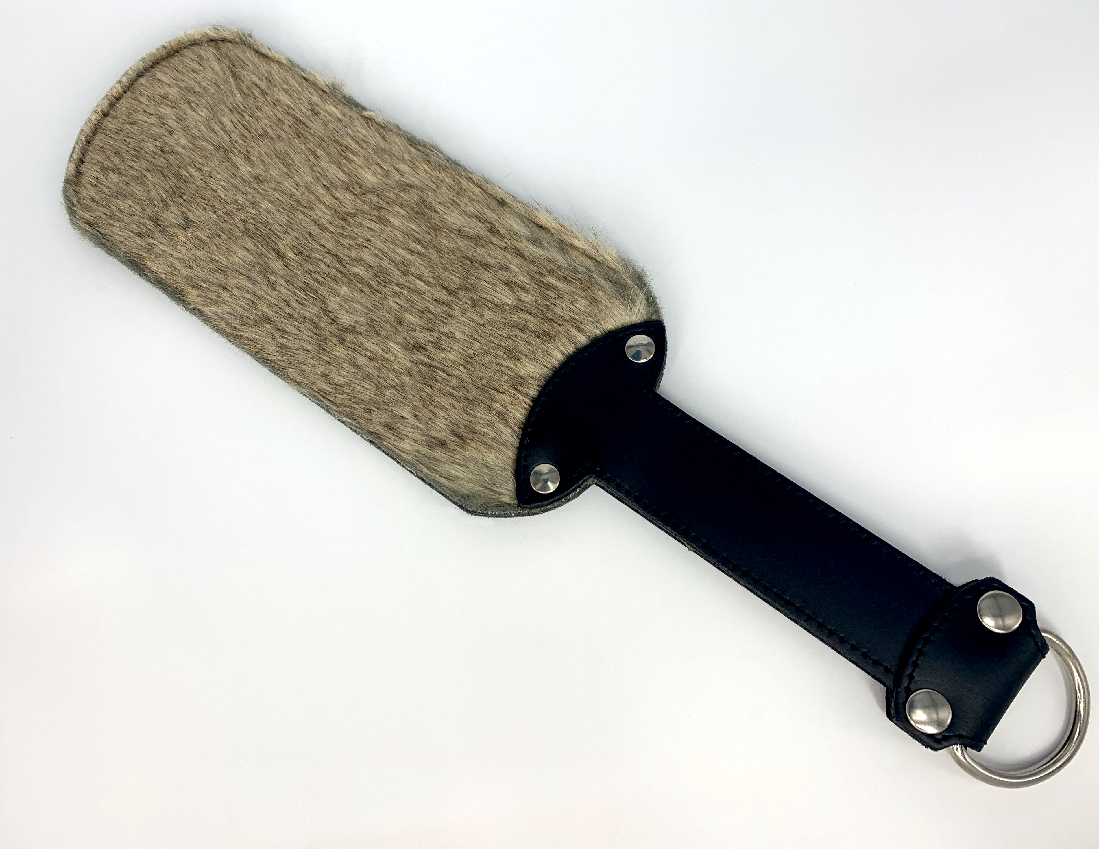 Paddle with synthetic fur on one side